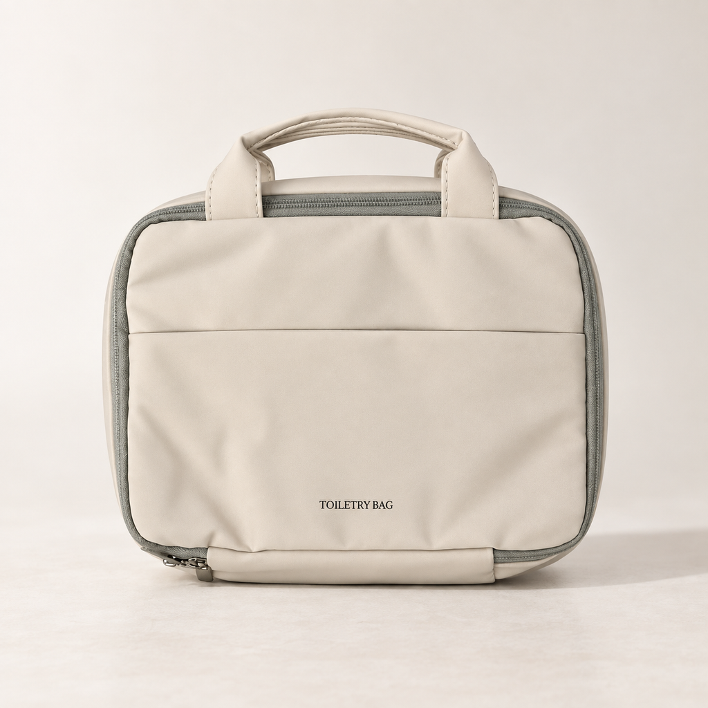 Closed warm beige hanging toiletry bag with carry handles and front pocket
