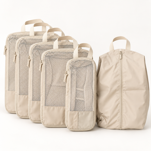 Five beige compression packing cubes and a double-sided shoe bag standing in a row